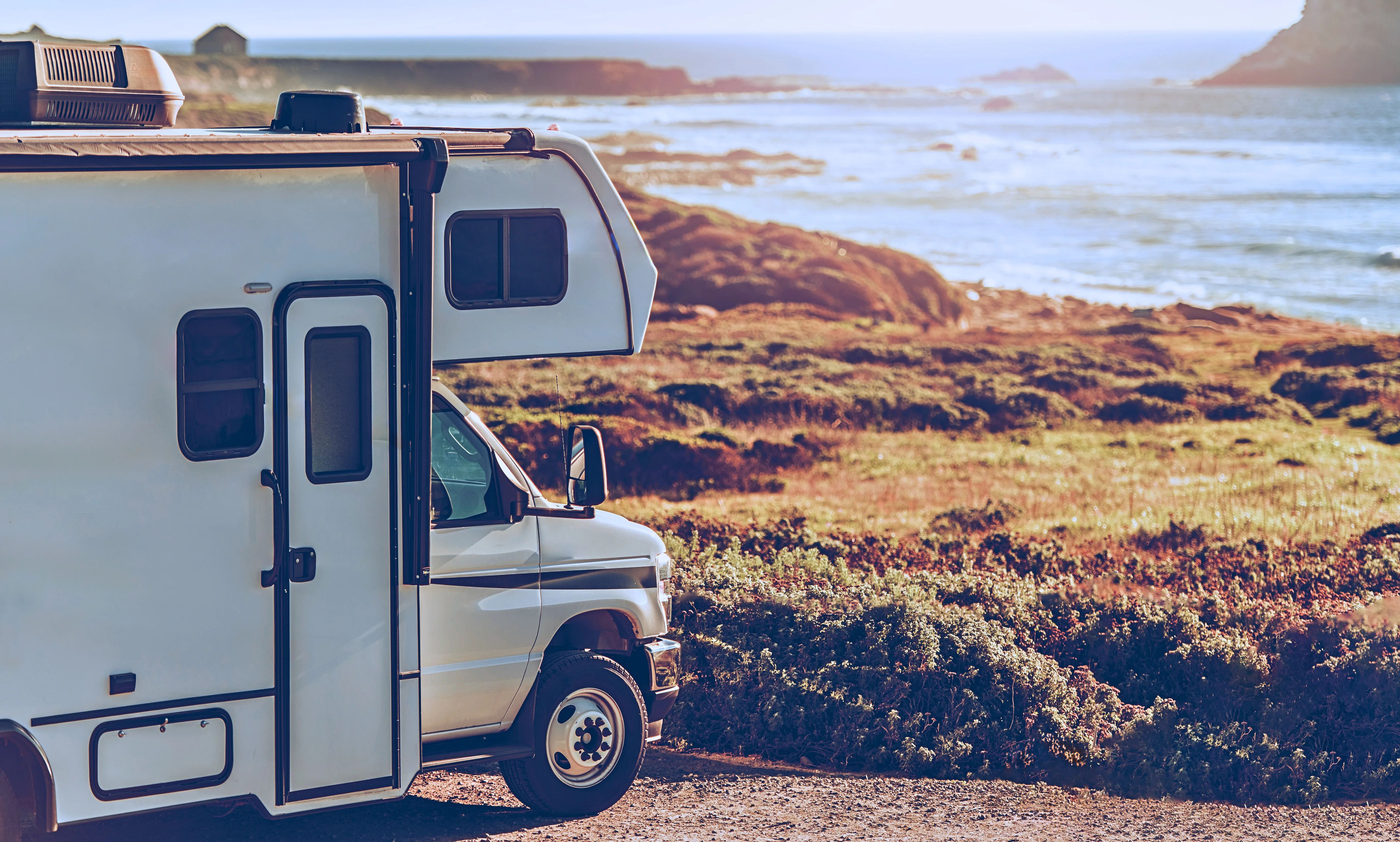 beach rv site of a motorhome parked on a bluff